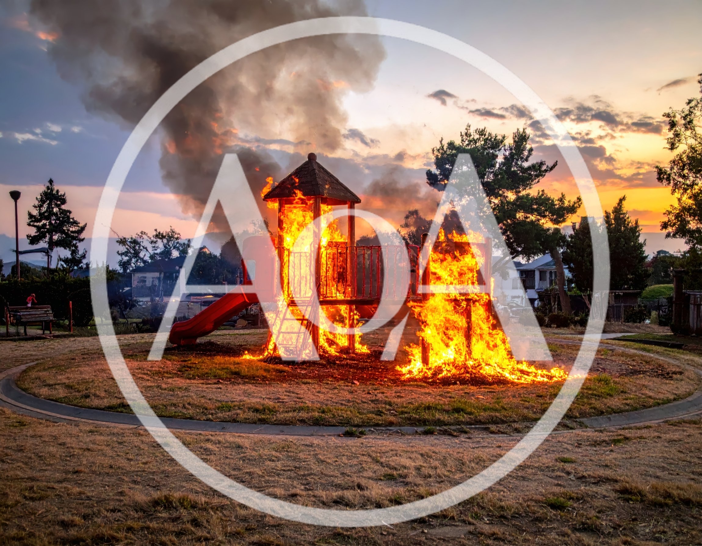 Playground Structure Engulfed in Intense Fire at Sunset