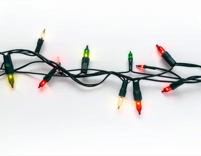 String Of Multicolored Christmas Lights On White Background