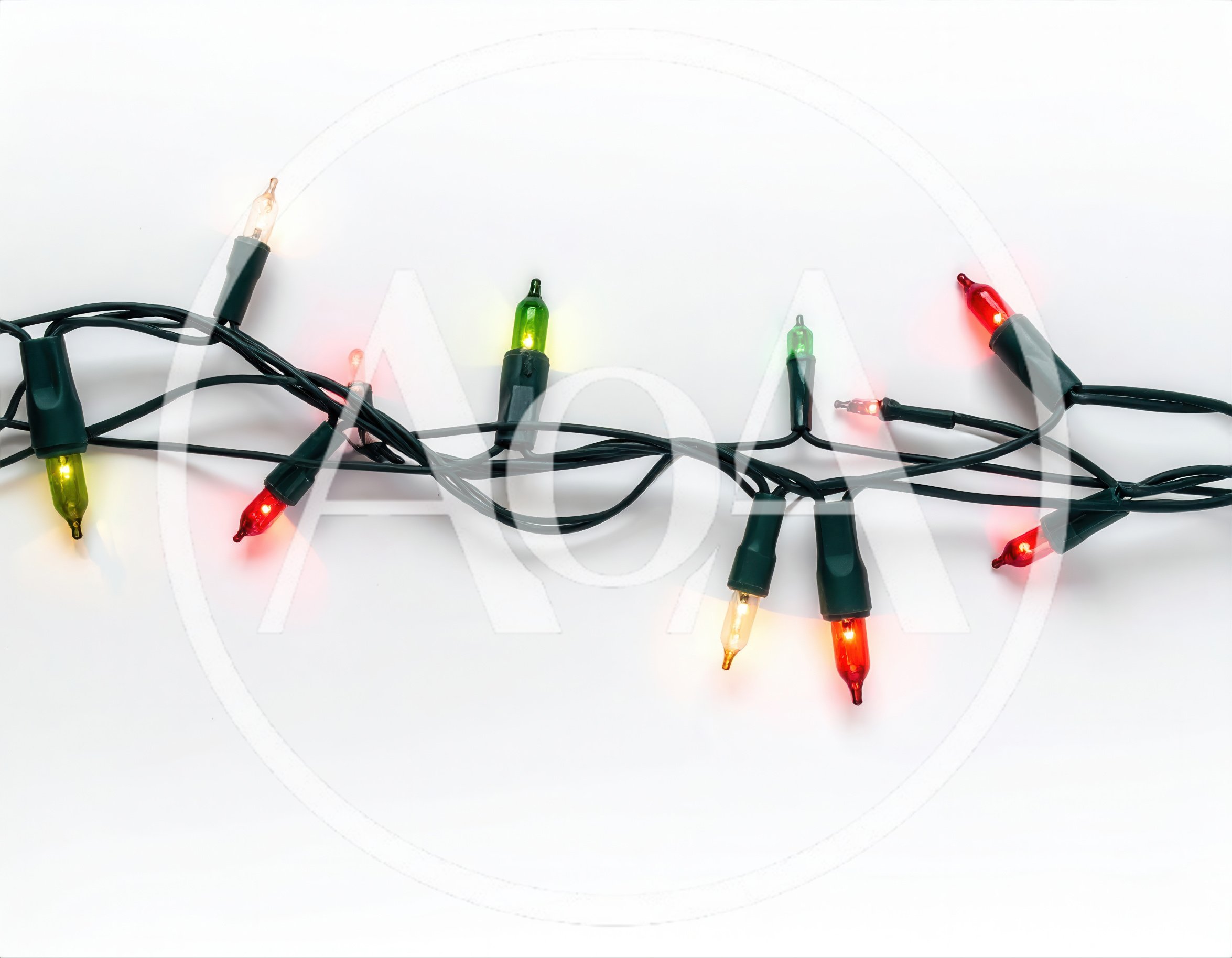 String Of Multicolored Christmas Lights On White Background
