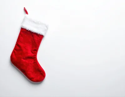 Red Christmas Stocking Hanging On White Background