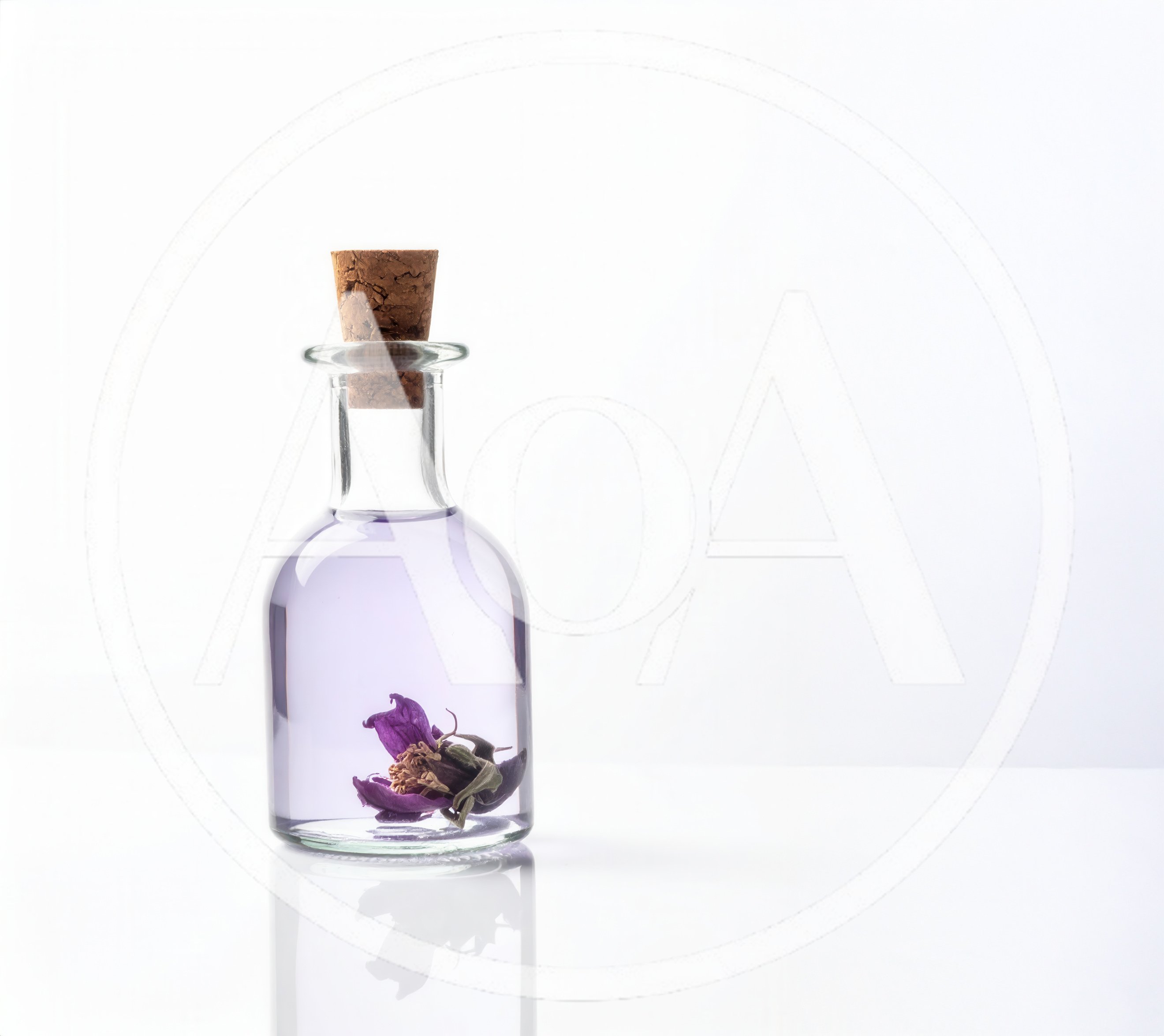 Glass Bottle With Purple Liquid And Dried Flower