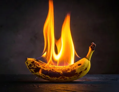 A Ripe Banana Burning With Bright Orange Flames