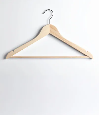 Wooden Clothes Hanger Isolated On White Background
