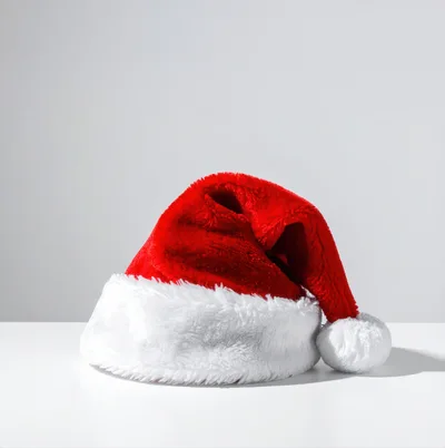 Red Santa Claus Hat On White Surface