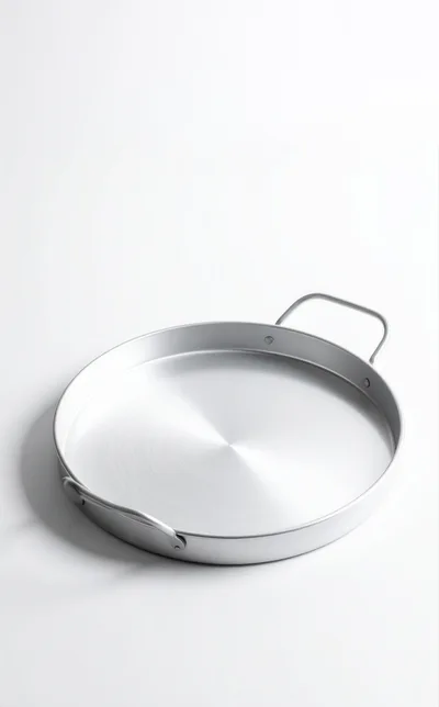 Empty Round Aluminum Paella Pan On White Background