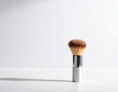 Makeup Powder Brush Standing On White Surface