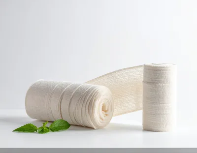 Two White Medical Compression Bandage Rolls