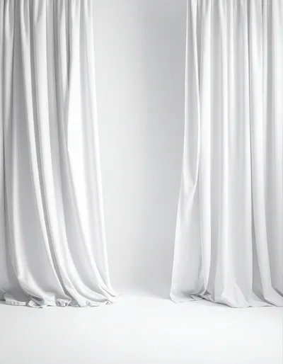 White Curtains Hanging Against A Plain Background