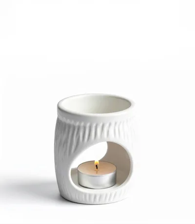White Ceramic Oil Burner With Lit Tea Light Candle