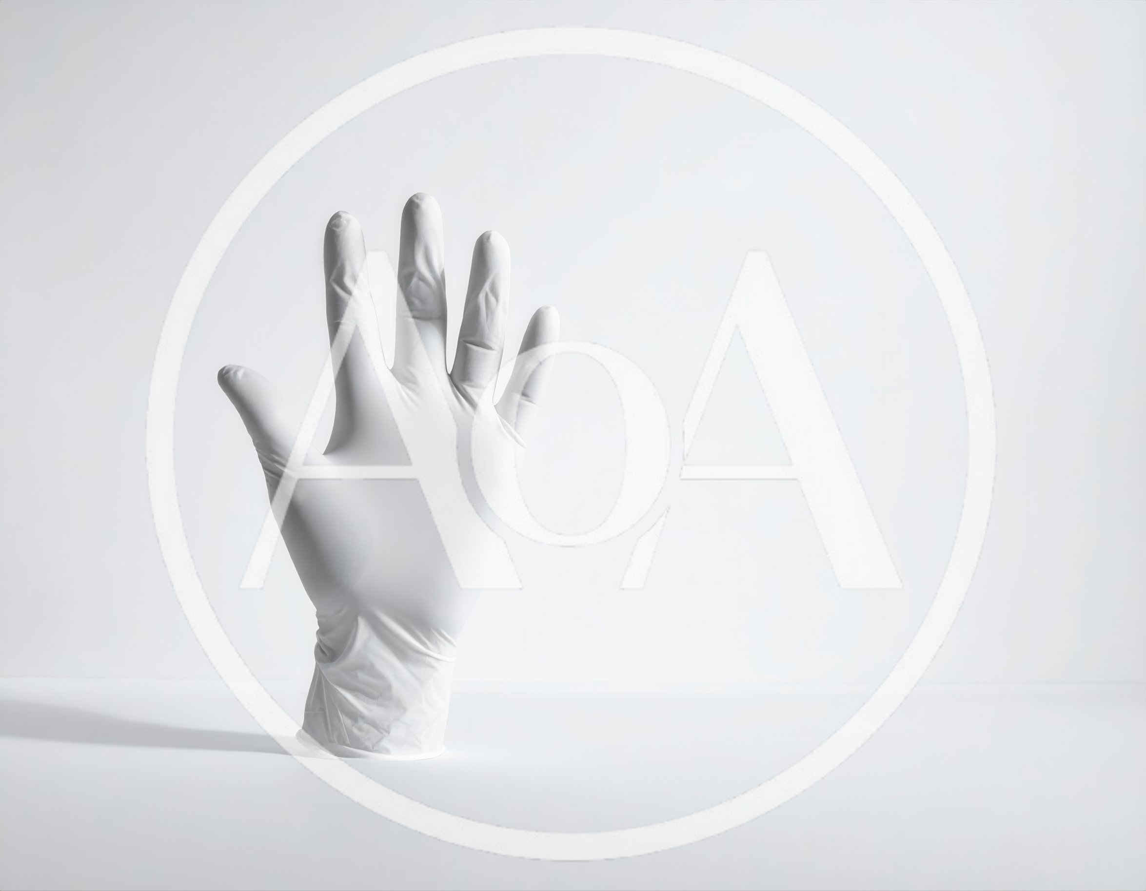 White Latex Glove Standing Upright On White Surface