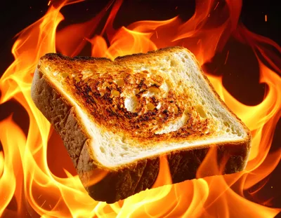 Single Slice Of Toasted Bread Surrounded By Intense Flames