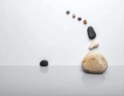 Zen Stone Balance Composition on White Background