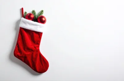 Red Christmas Stocking With Ornaments On White Background