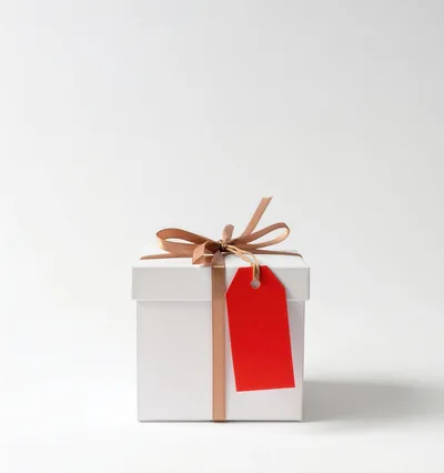 White Gift Box With Ribbon And Red Tag