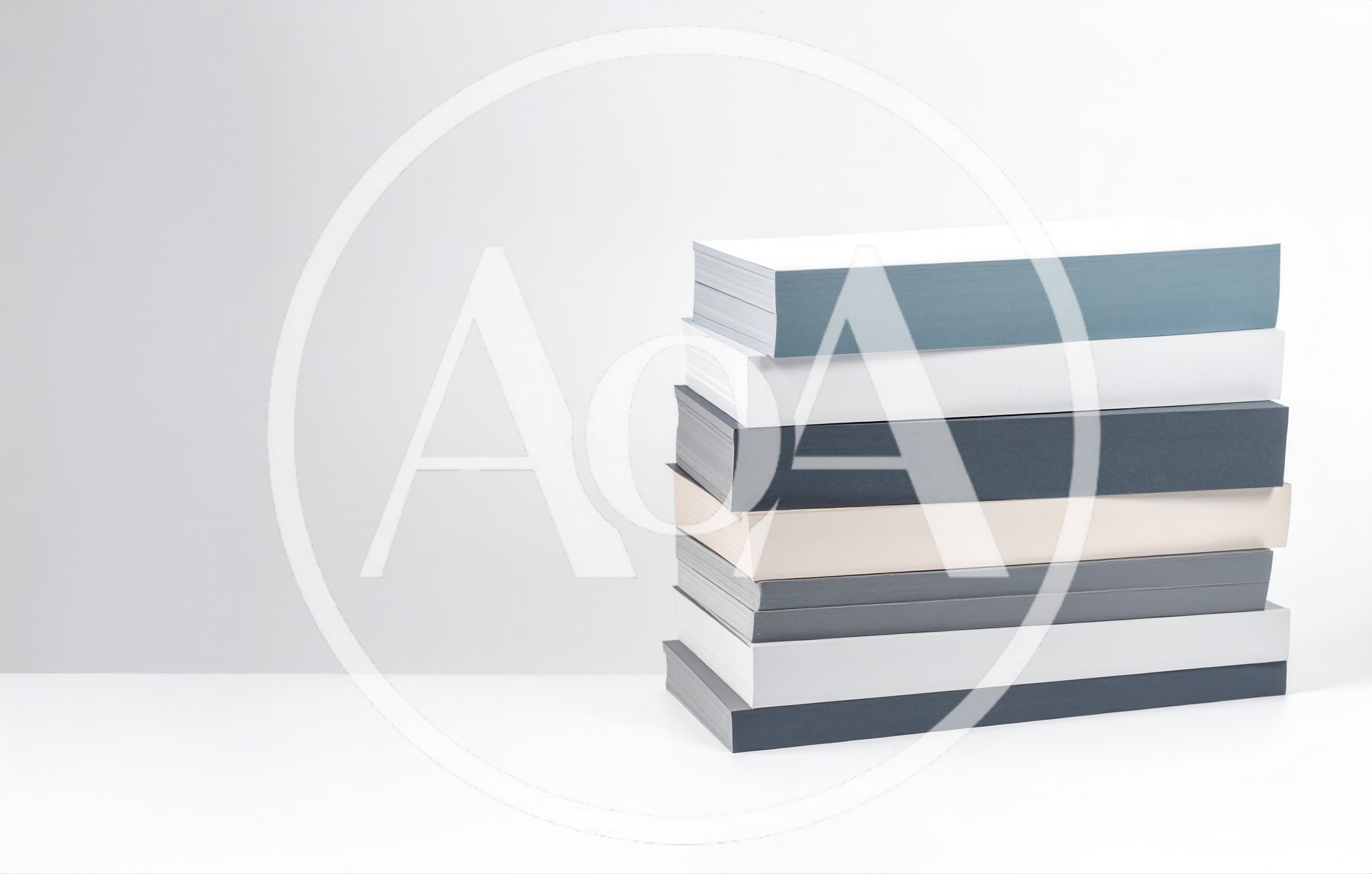 Stack Of Minimalist Books On White Surface