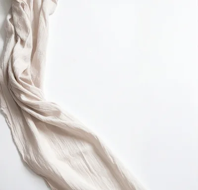 Beige Gauze Fabric Draped on White Background
