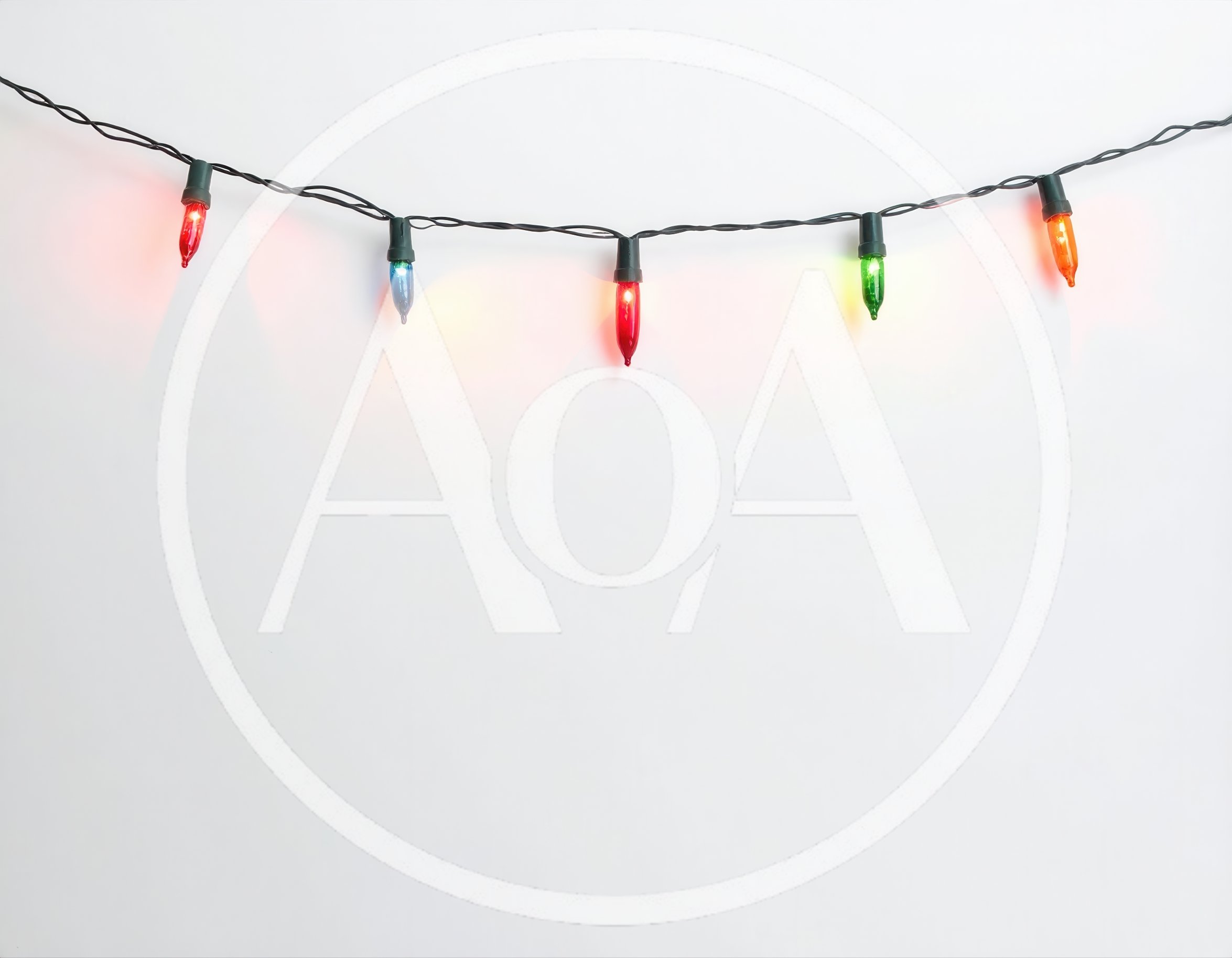 String Of Colorful Christmas Lights On White Background