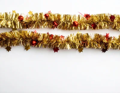 Two Horizontal Gold Tinsel Garlands With Red Ornaments
