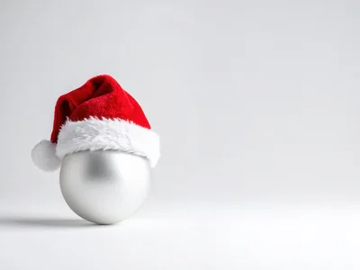 Silver Christmas Ornament Wearing A Santa Hat