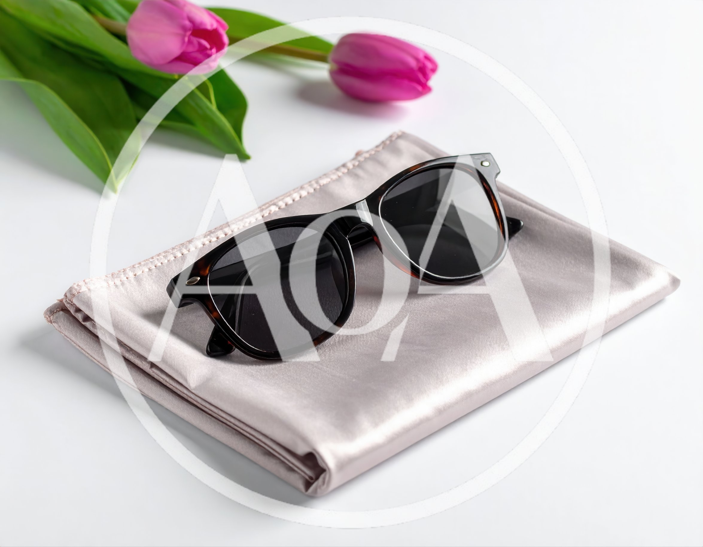 Sunglasses Resting On A Folded Silk Scarf