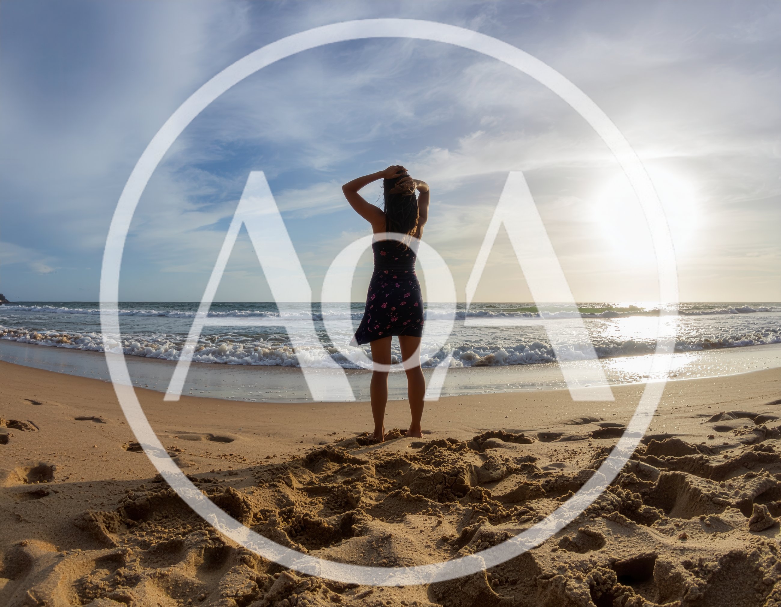 Woman Standing On Beach At Sunset