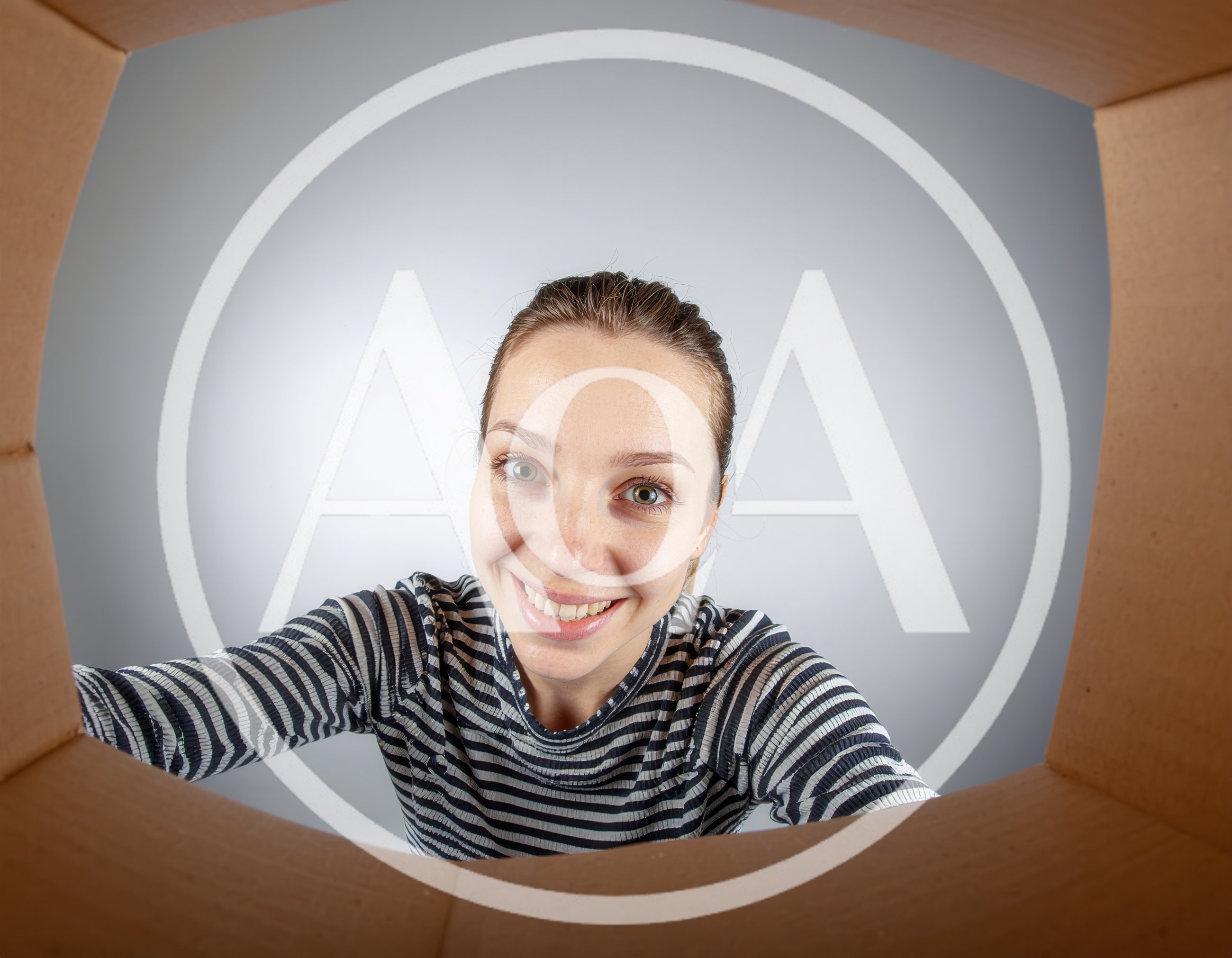 Woman Looking Into A Cardboard Box