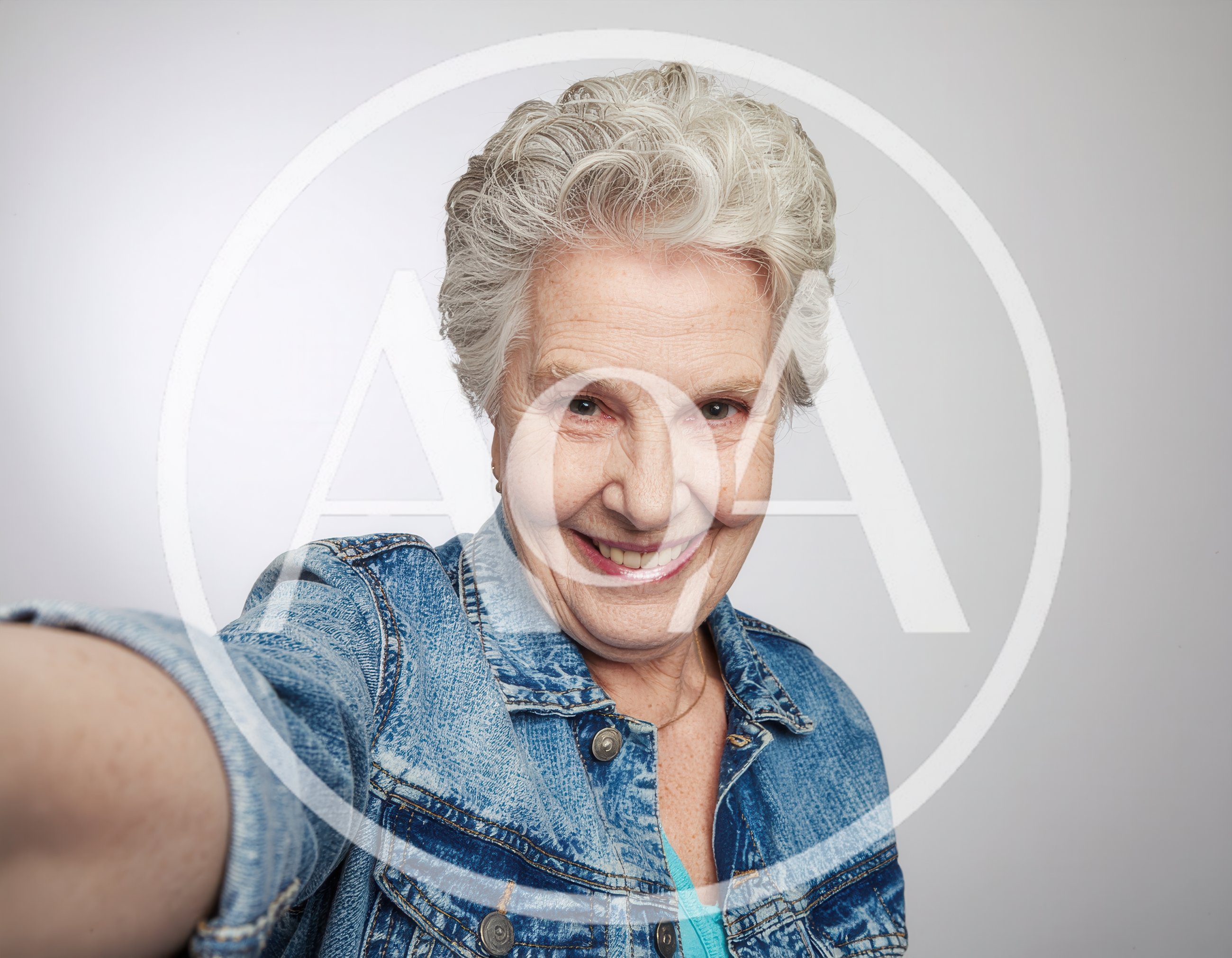 Senior Woman Taking A Selfie In Denim Jacket