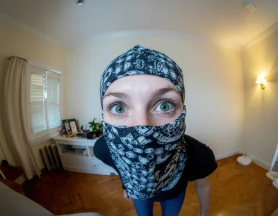 Person Wearing Patterned Balaclava Looking Into Camera