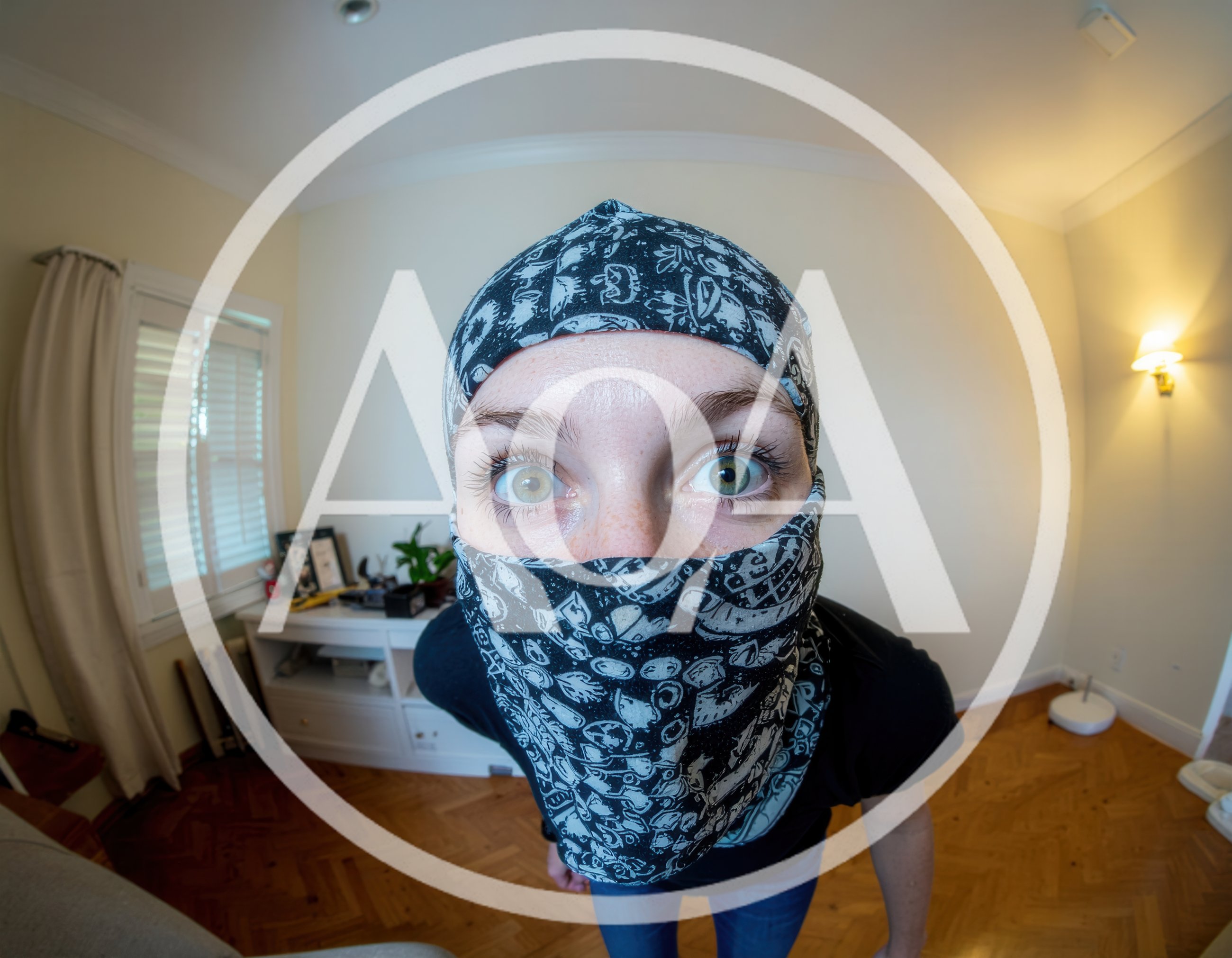 Person Wearing Patterned Balaclava Looking Into Camera