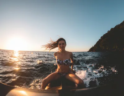 Woman Riding Jet Ski During Golden Hour