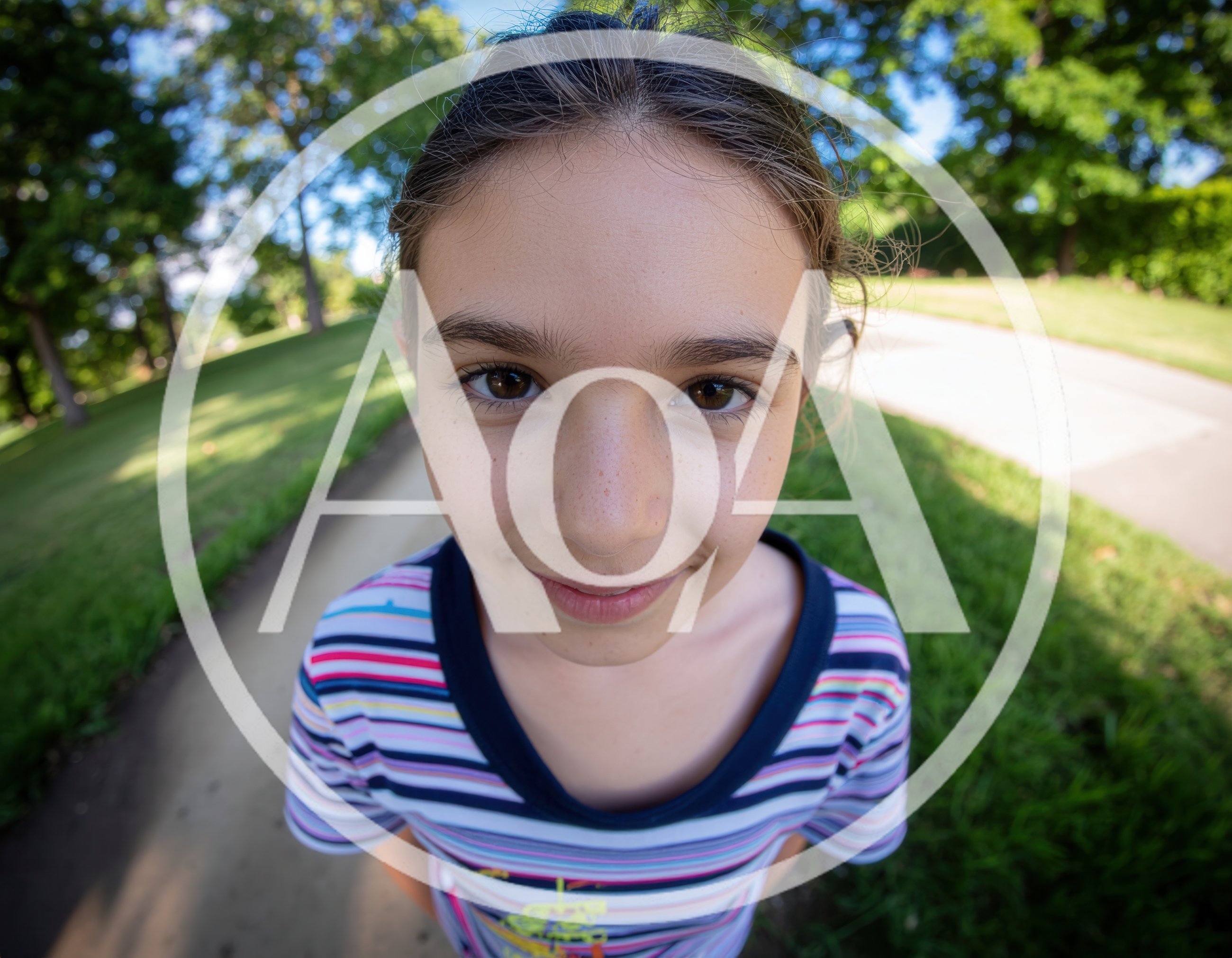 Young Girl Looking Directly Into Fisheye Camera Lens