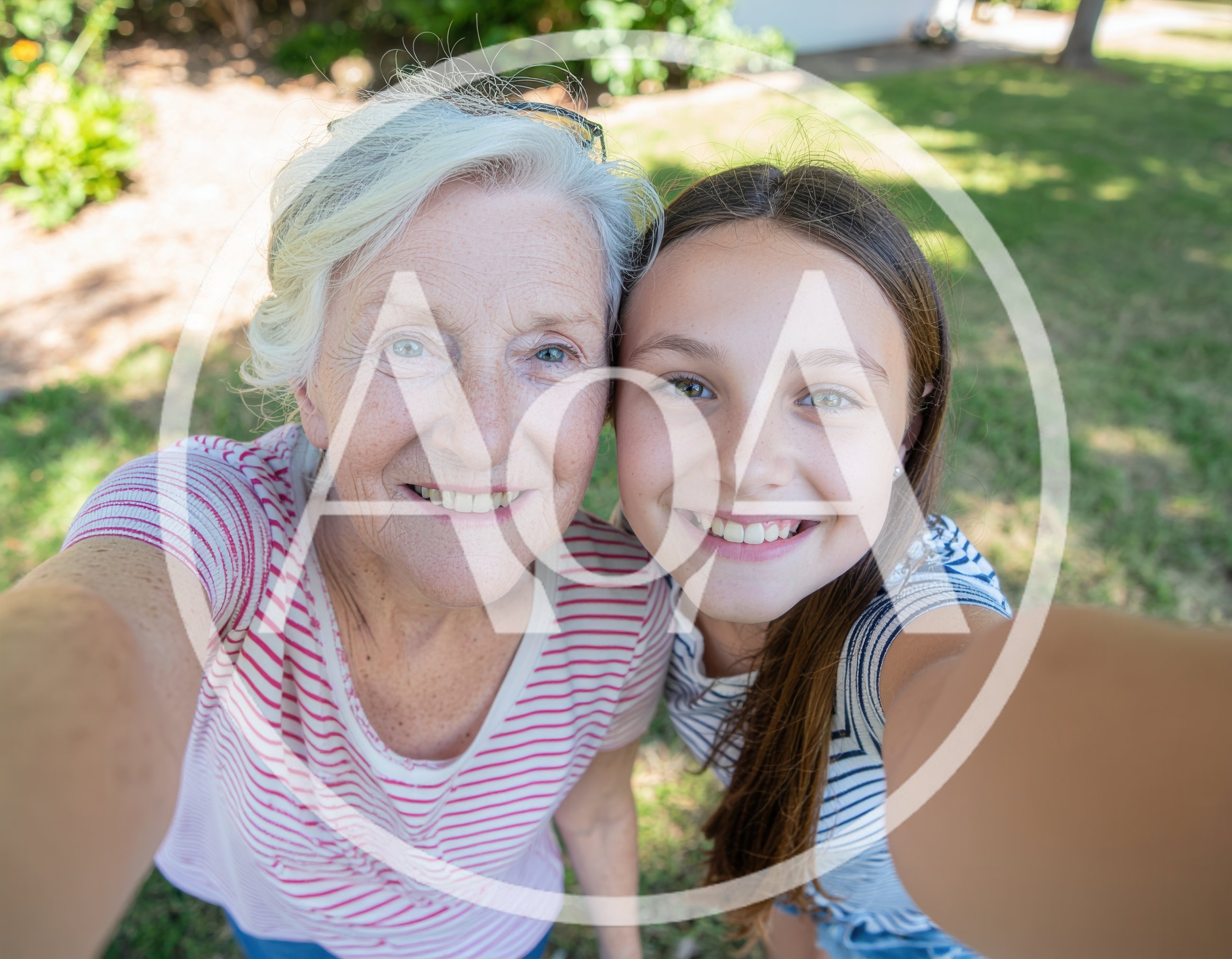 Grandmother and Granddaughter Taking a Selfie Outdoors