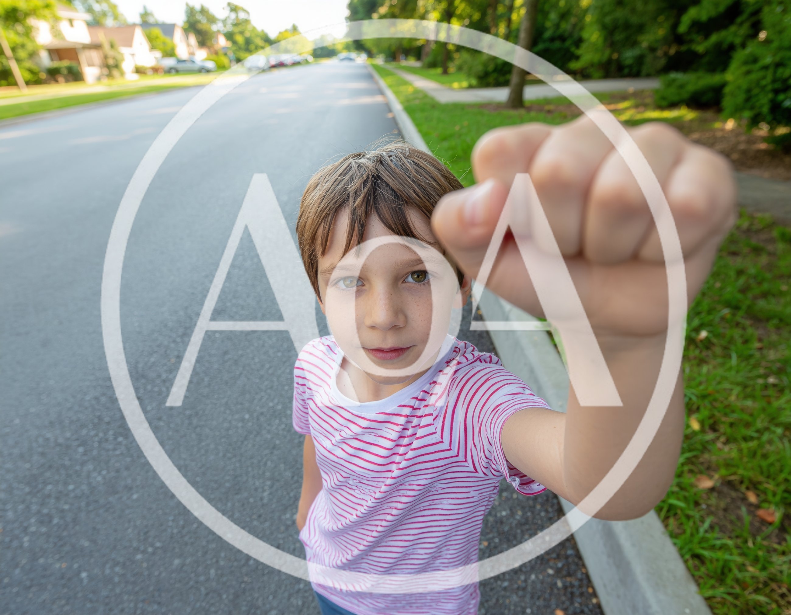 Young Boy Holding Fist Toward Camera