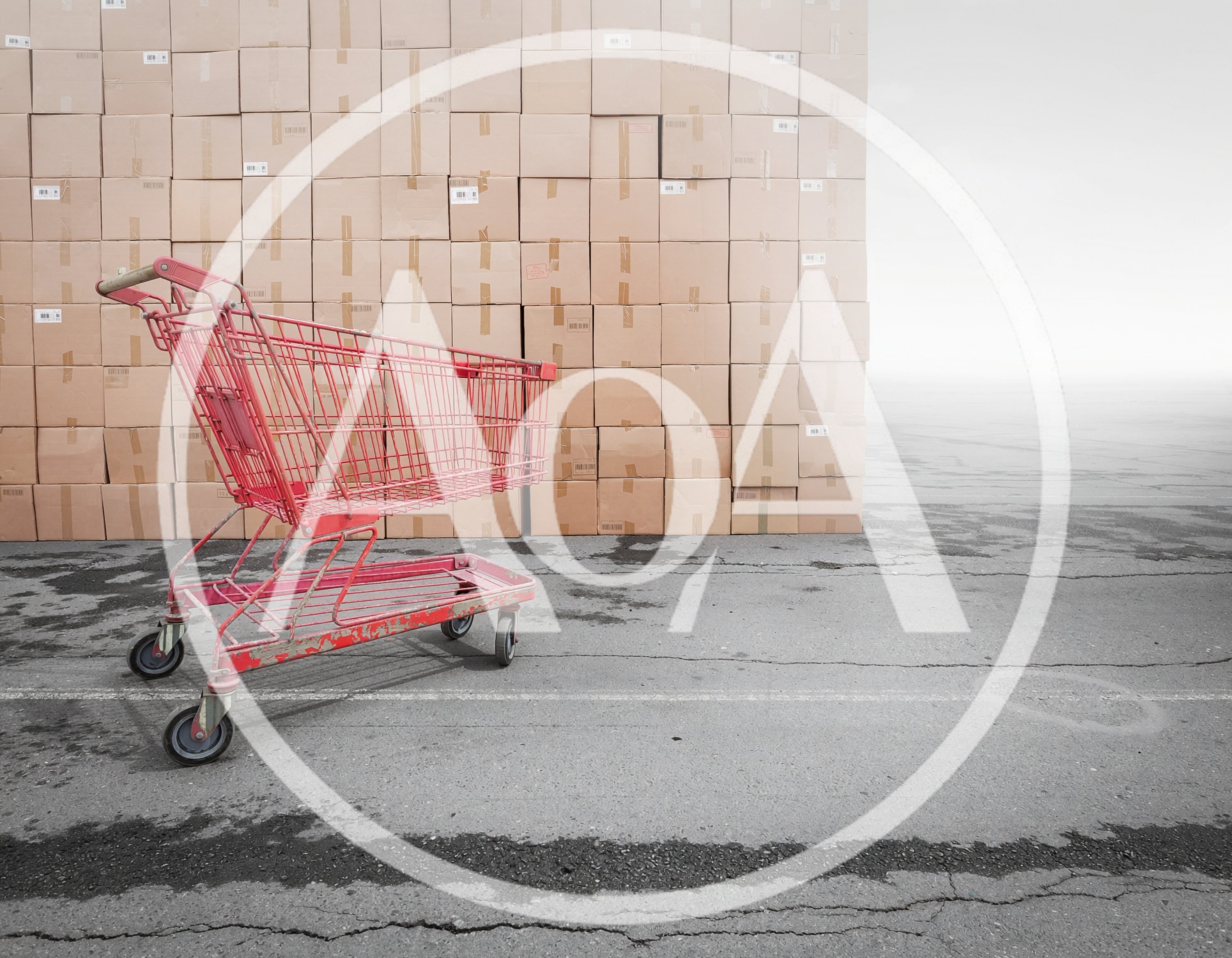 Red Shopping Cart Standing Before A Large Stacked Wall