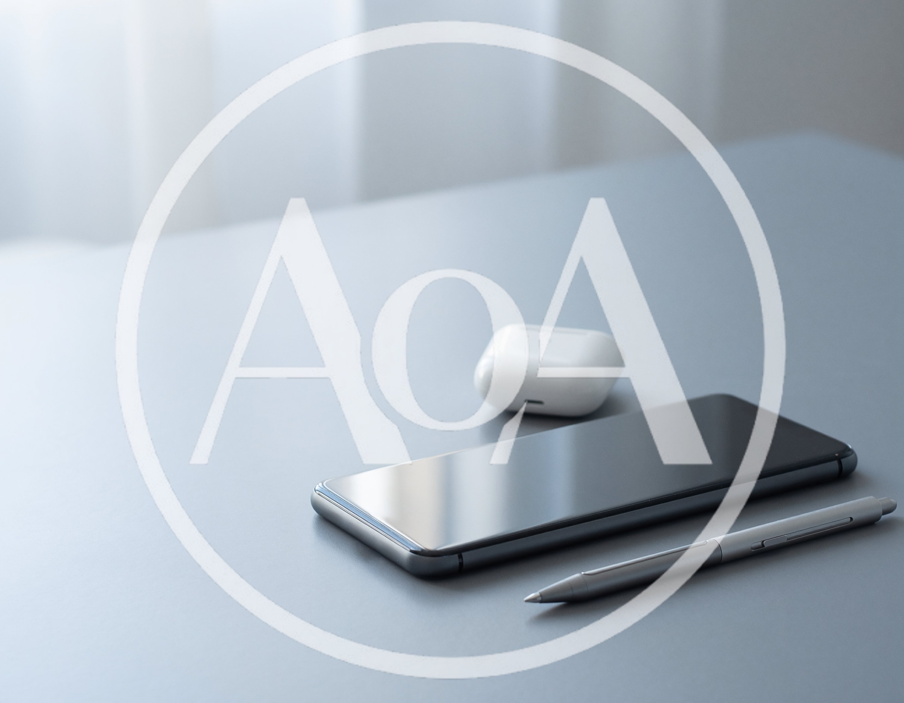 Smartphone Earbuds and Stylus Pen on Desk