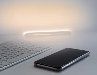 Smartphone And Wireless Keyboard On A Minimalist Desk