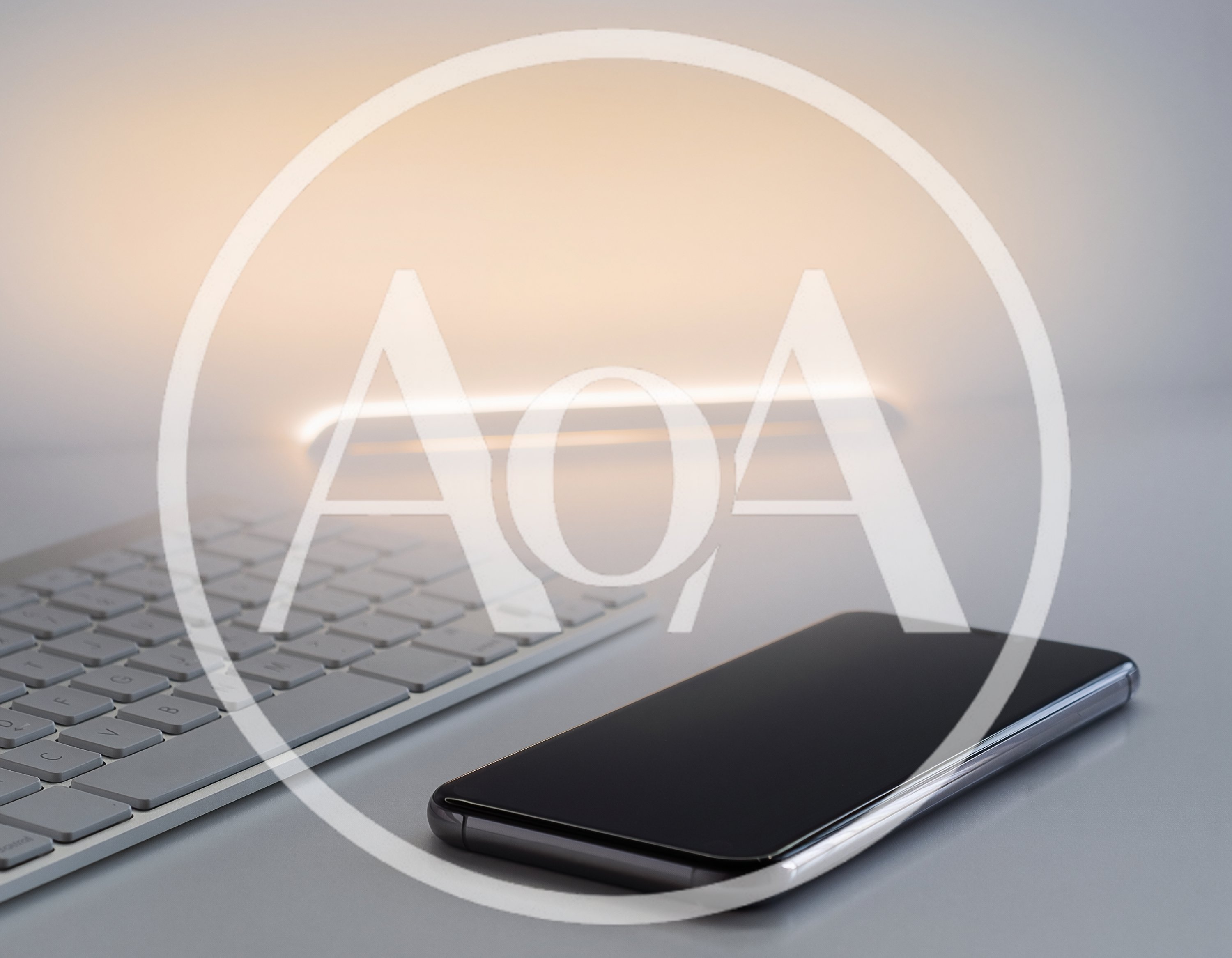 Smartphone And Wireless Keyboard On A Minimalist Desk