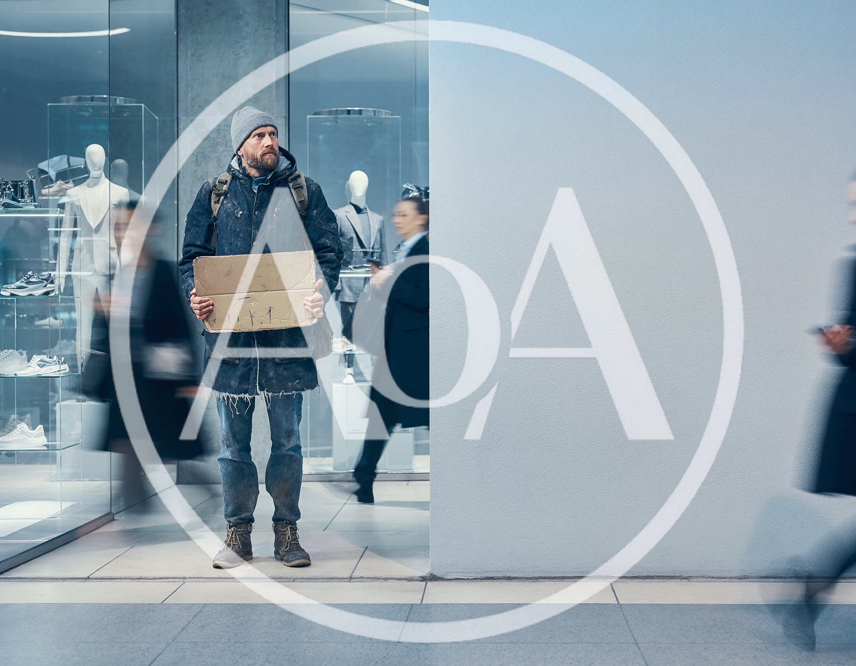 Homeless Man Holding Cardboard Sign In Modern Shopping Mall