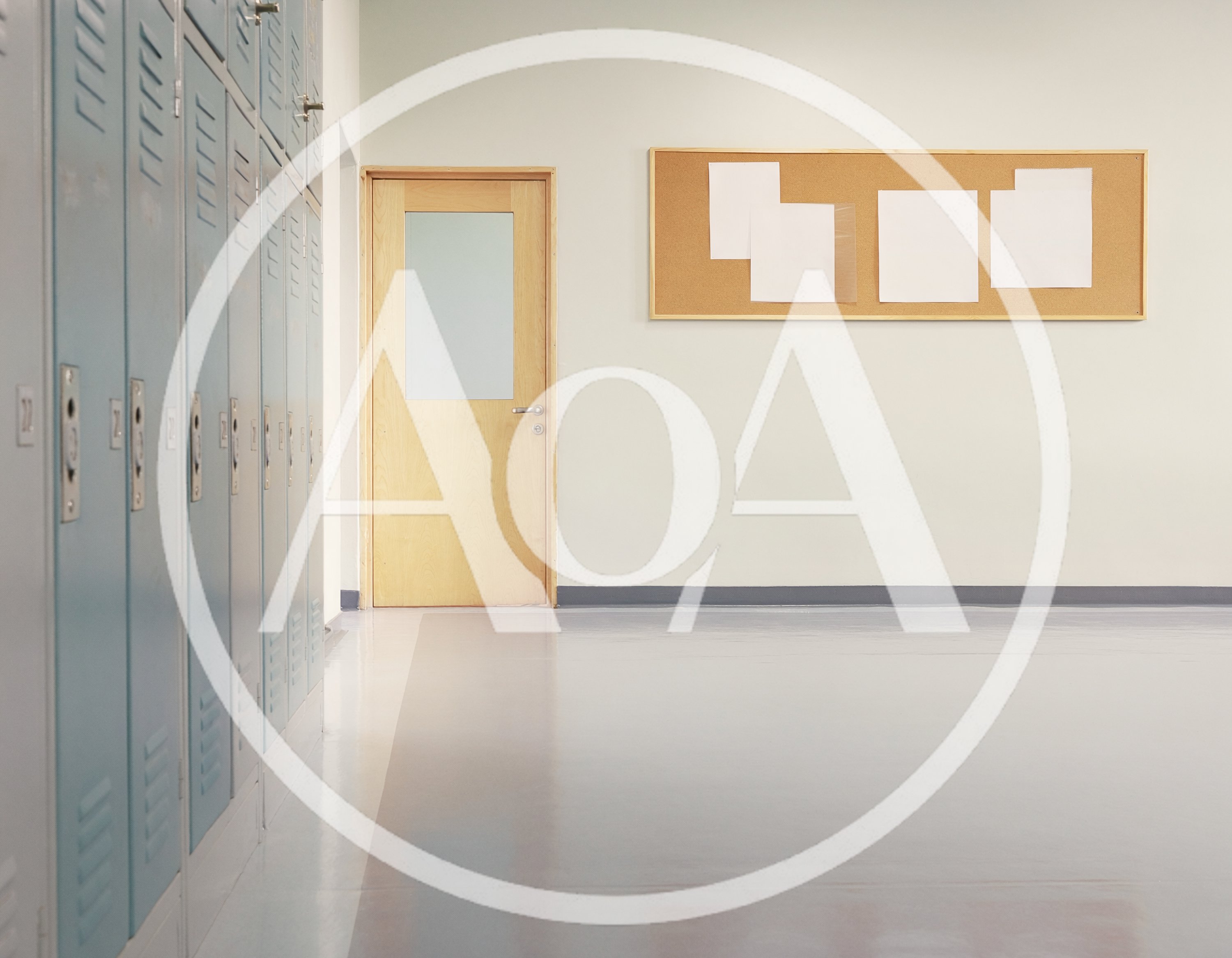 Empty School Hallway With Lockers And Bulletin Board