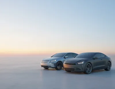 Two Modern Concept Cars Parked On A Vast Plain