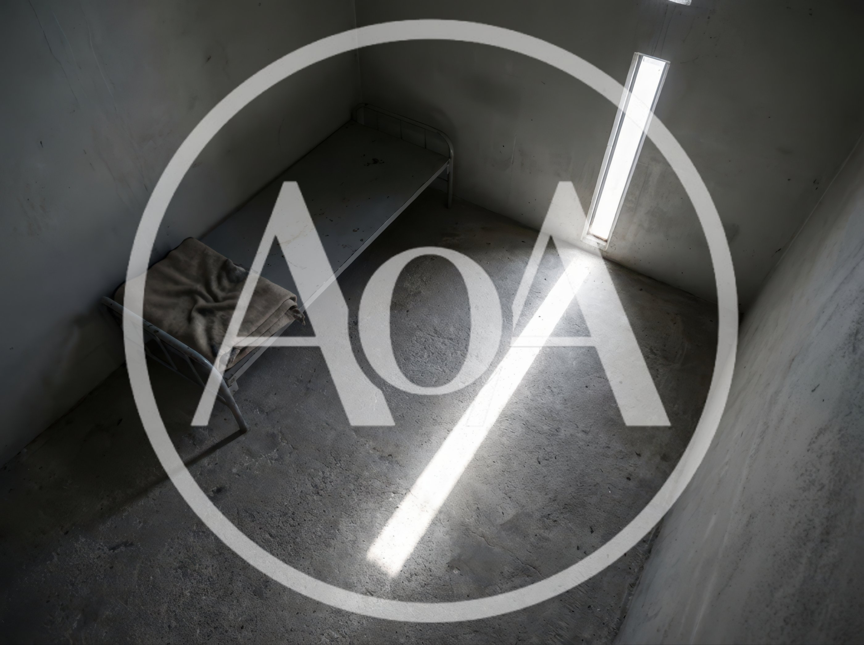 Empty Prison Cell With Metal Bed Frame