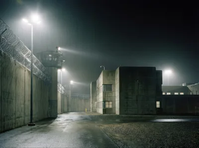High Security Prison Exterior At Night