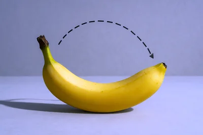 Yellow Banana With A Dashed Arrow Path