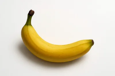 Single Ripe Yellow Banana on White Background