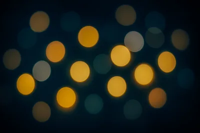 Abstract Bokeh Background With Glowing Golden Circles