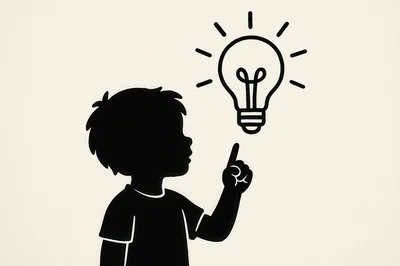 Silhouette Of A Child Pointing At A Lightbulb