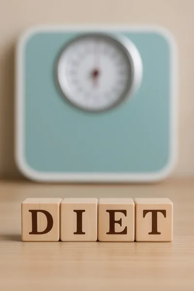 Wooden Blocks Spelling Diet With A Weighing Scale