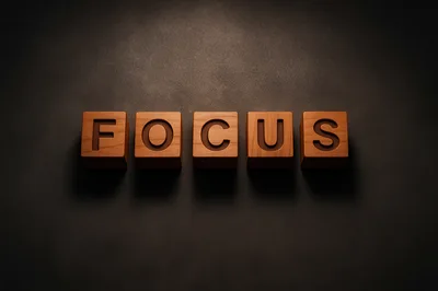 Wooden Blocks Spelling Focus on Dark Background