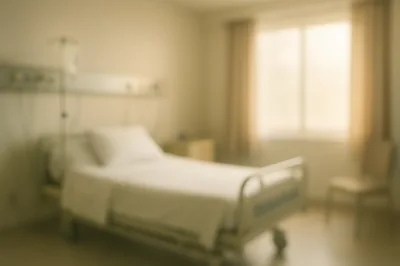 Blurred Hospital Room With Empty Patient Bed