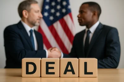 Businessmen Shaking Hands In Front Of American Flag